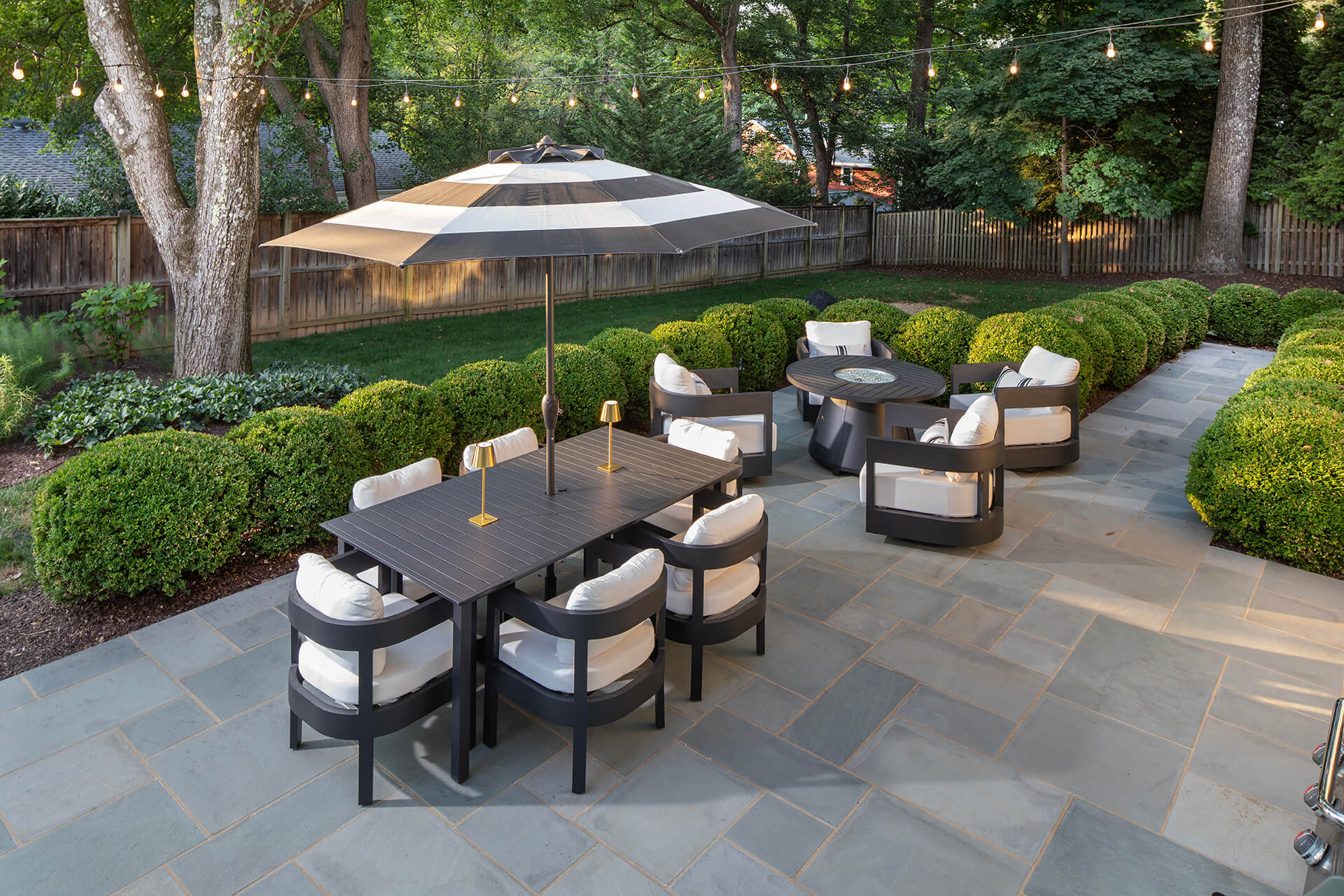 dining patio perfectly maintained boxwood border hedge