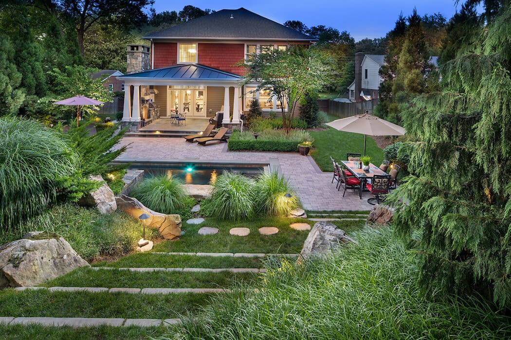 backyard landscaping with pool and patio dining