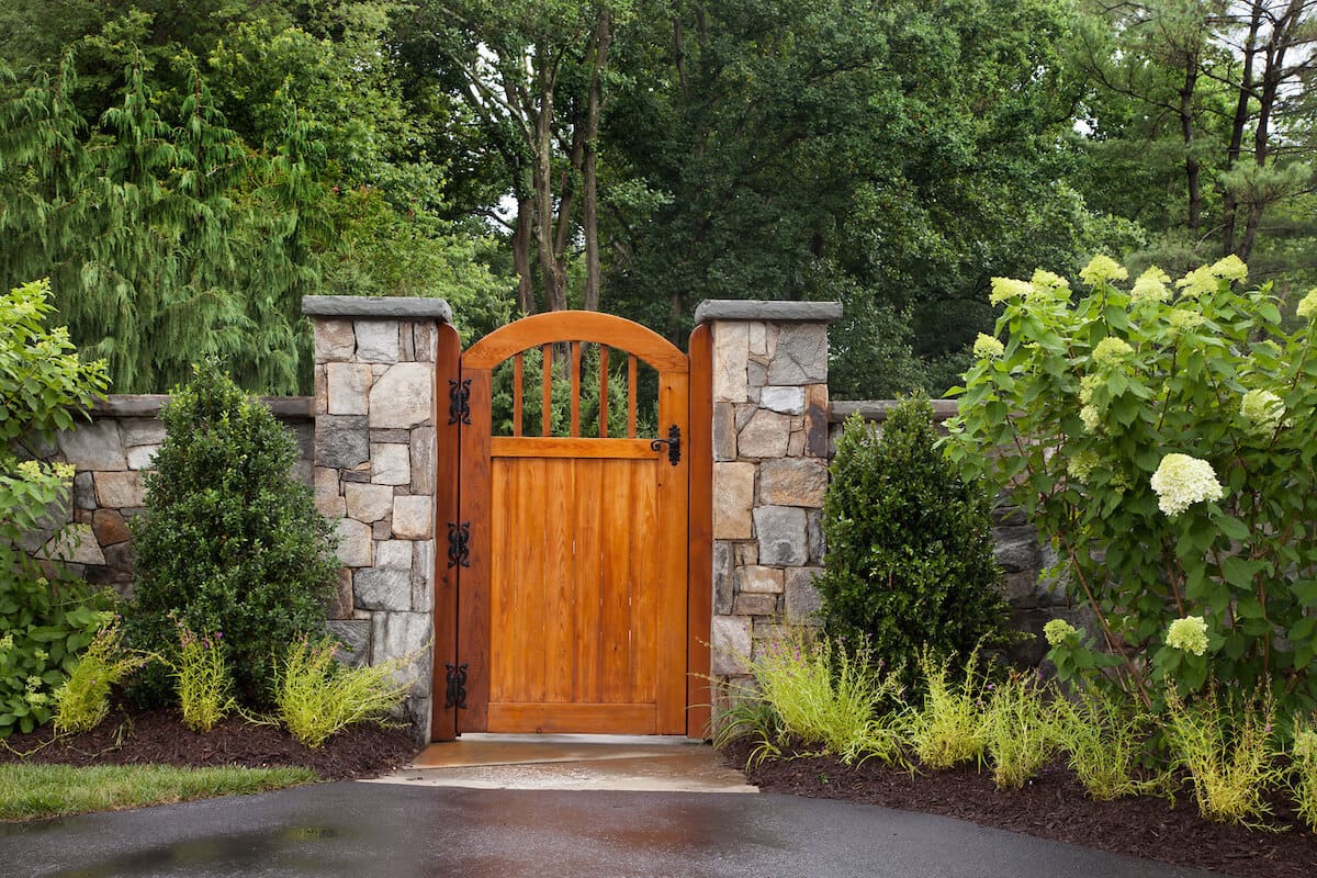 garden gate of redwood and stone