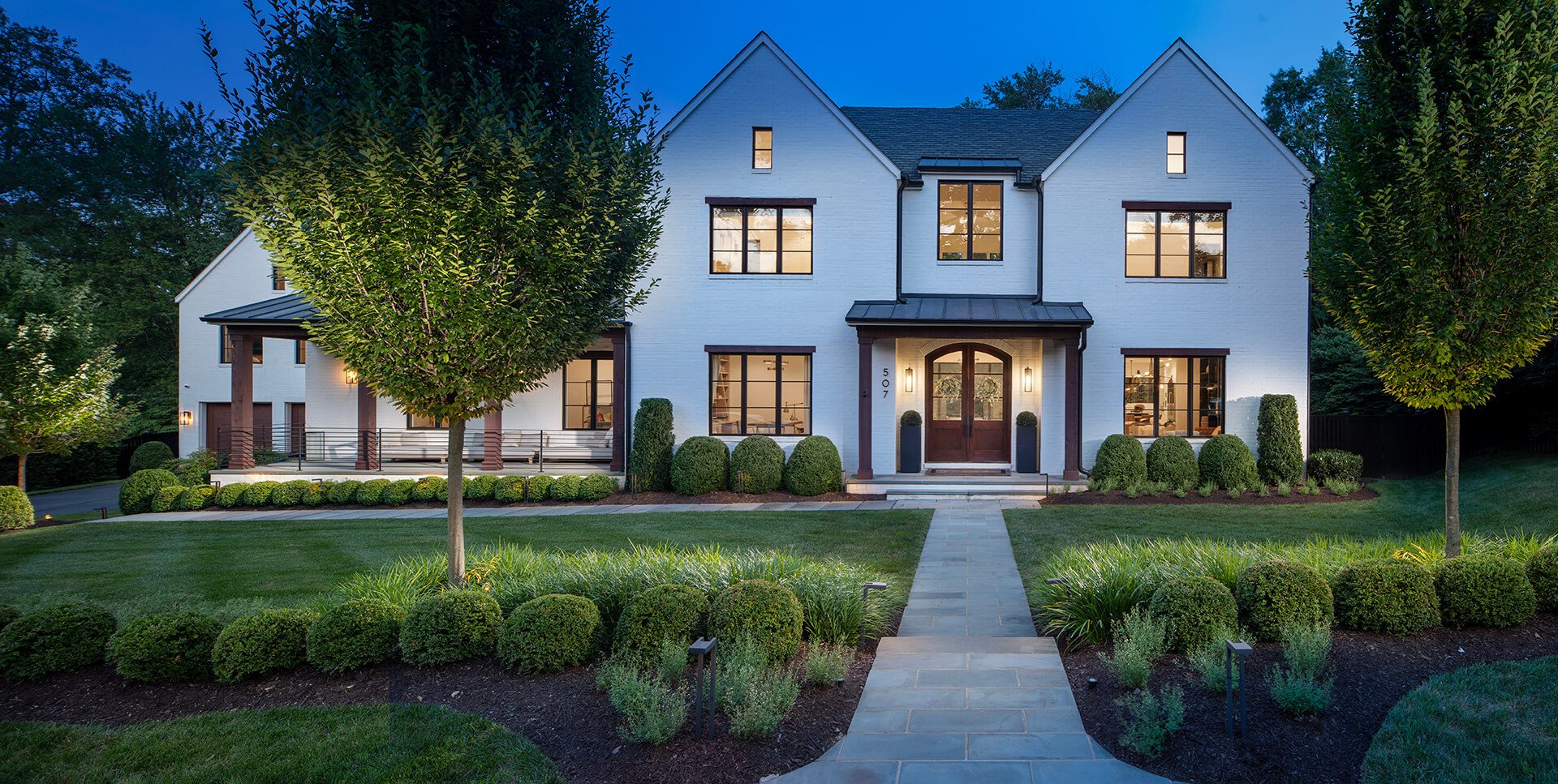 symmetrical front yard design with layered landscaping